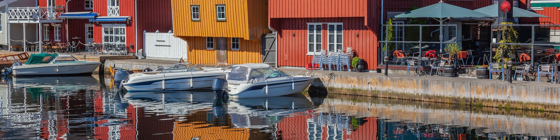 A harbor with colorful houses and boats.