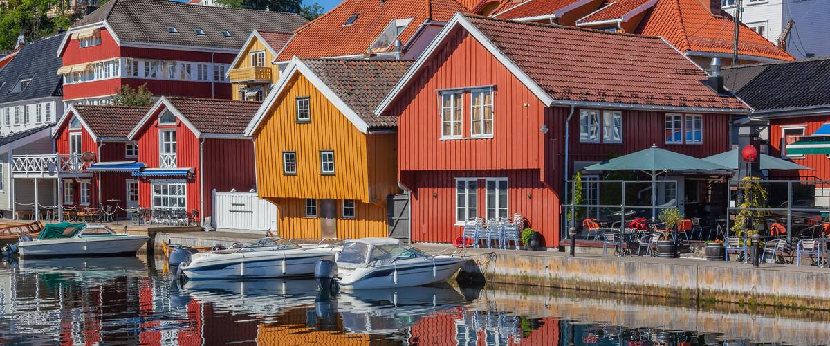 A harbor with colorful houses and boats.