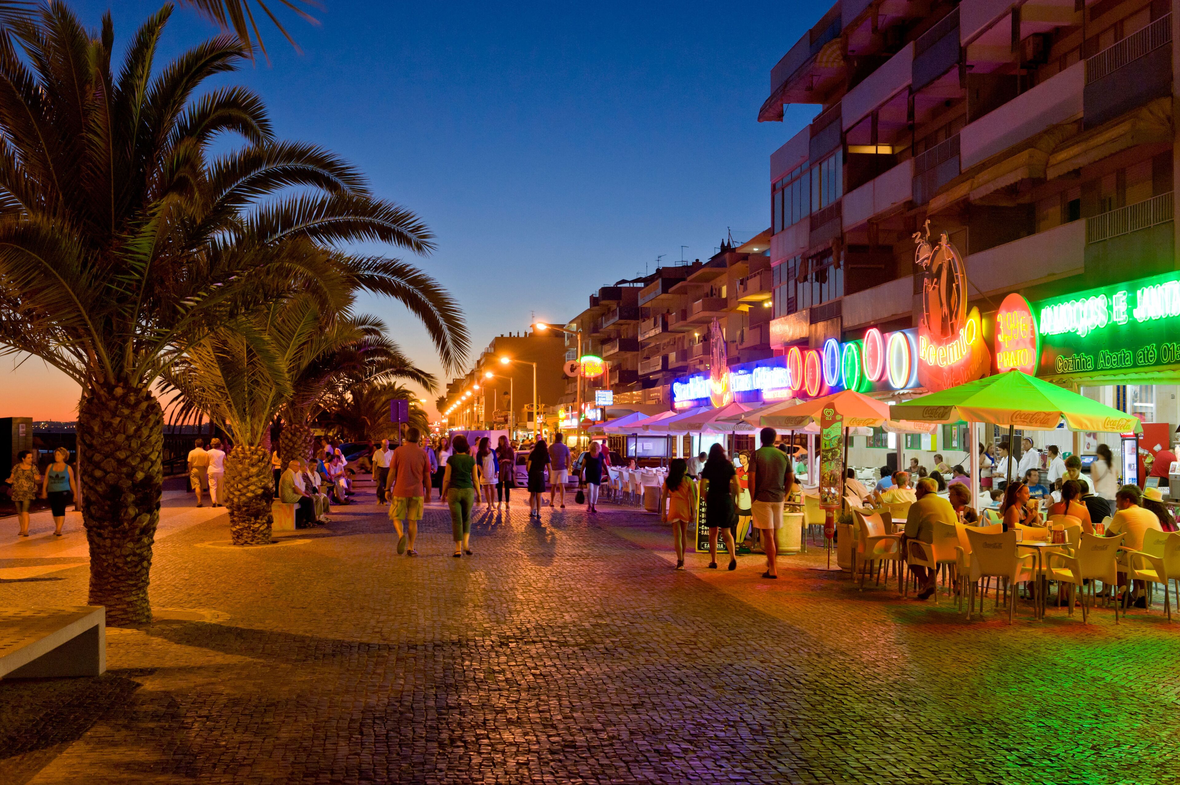 Portugal, the Algarve, Quarteira promenade at dusk