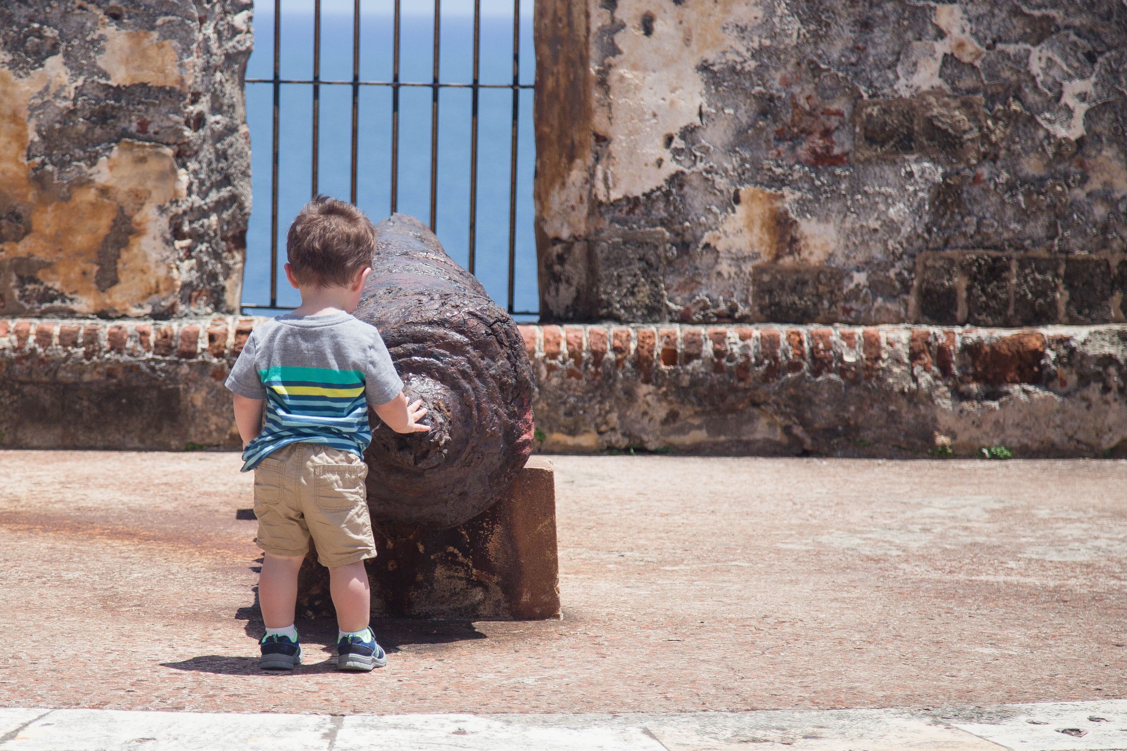 boy at the fort in Puerto rico el morro Castillo san Felipe old san Juan Puerto rico cannon  stock photo royalty free 