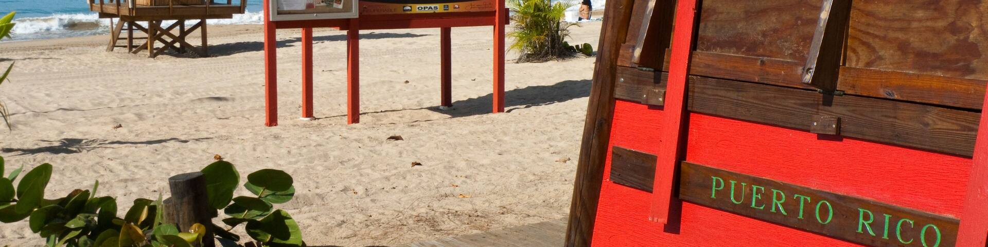 Beach pavilions and a lifeguard hut on the beach, Carolina Beach, Carolina, Puerto Rico