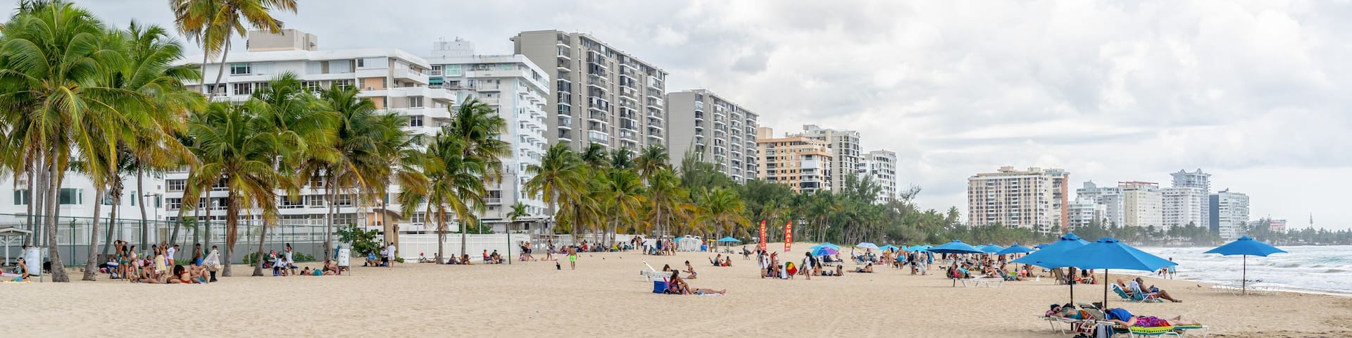 Isla Verde, Puerto Rico - March 29, 2019: Beach-goers Enjoying the Beautiful Beaches of Isla Verde, Puerto Rico.