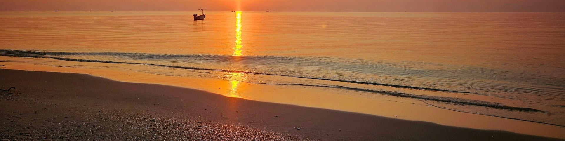Serene Morning Dawn with Local Fisherman Boat in the romantic atmosphere ocean.