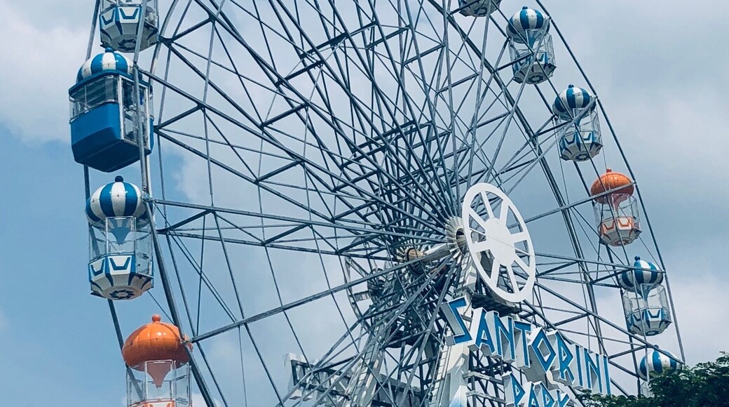 Santorini Park, Hua Hin, Thailand - a mini theme park with rides, and cute blue & white buildings housing shops and restaurants/eateries.