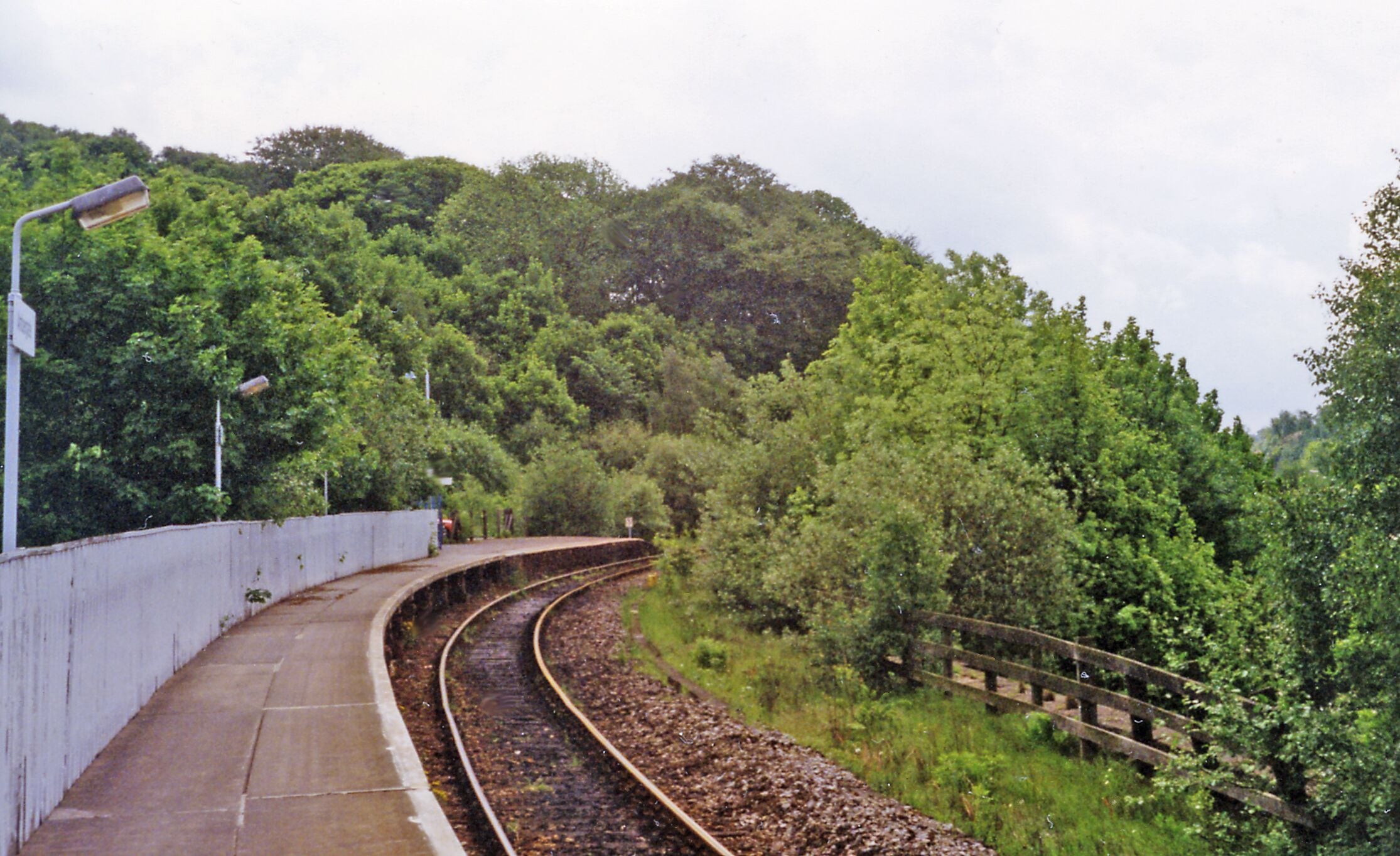 Ambergate station, 1995. View southward, towards Derby: ex-Midland main lines northwards from Derby, to Sheffield, Leeds etc. and to Buxton and Manchester. Although by-passed by expresses on the Derby - Sheffield route, Ambergate station was a main-line station on the main Peak Line (closed 6/3/67 north of Matlock) which was also served by slow trains to Chesterfield and Sheffield. As well, by trains on the line to Pye Bridge on the Erewash Valley route, at platforms on an east-to-north loop (closed 2/1/57 for passengers, 2/2/67 for goods) which made Ambergate an unusual triangular station. In former times there was also constant coal and freight traffic going through on all these lines, making Ambergate extremely busy, but since the 1960's run-down all that remains is this single platform that serves the Derby - Matlock local service.