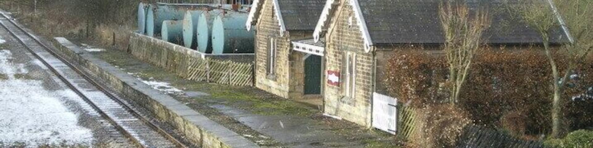 Shottle station buildings No longer in use for passenger traffic by the look of things. The blue tanks in the yard beyond belong to a fuel distribution company (whose name I didn't establish), but they appear to be using the station as offices.