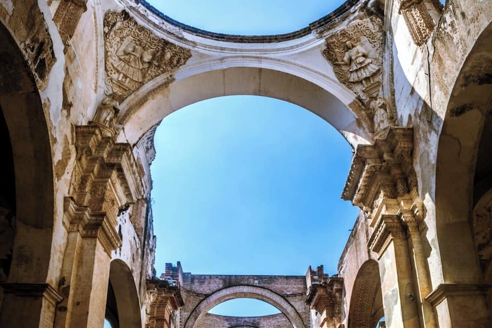 An ancient architectural structure with arched ceilings and columns.