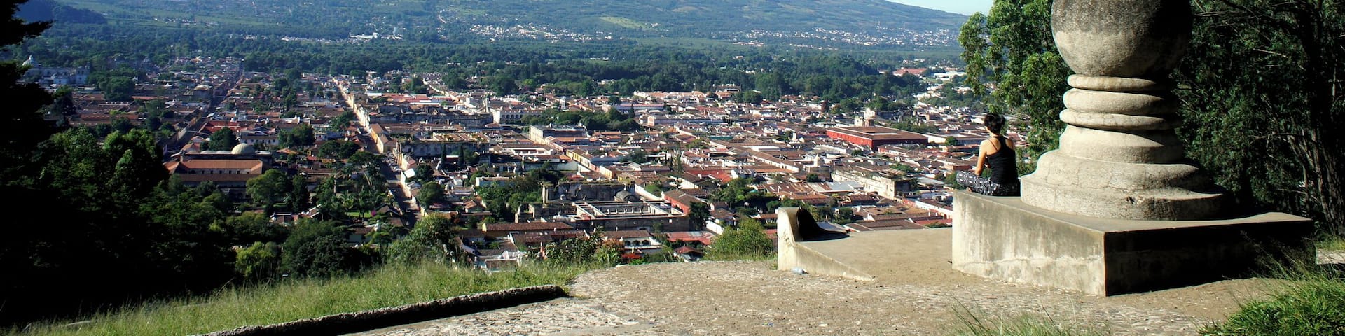 A cross, a town, and a mountain.