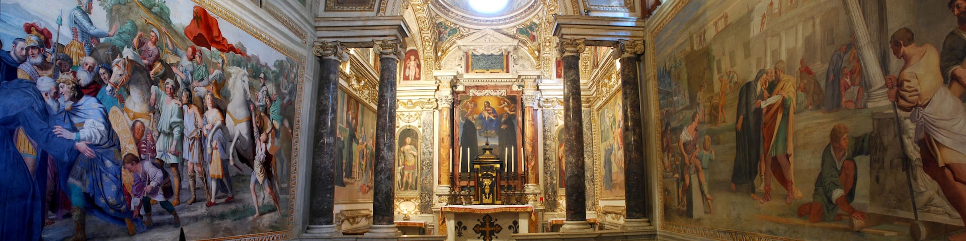 A grand interior with elaborate frescoes, ornate columns, and a central altar.