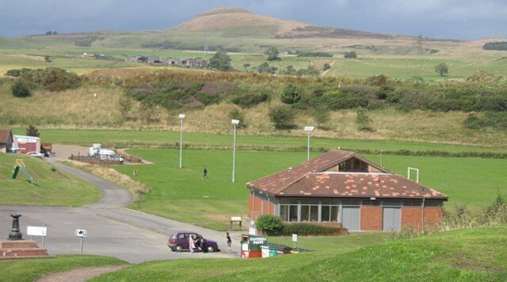 Car park and pavilion, Hawk Hill Park in Leslie with Falkland Hill on the skyline.