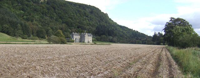 Castle Menzies Vieweed from the south-west over a potato field.