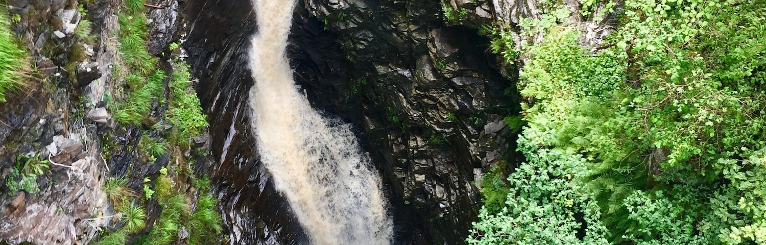 This plunging box canyon, through which the River Droma rushes, is one of the natural wonders of the Scottish Highlands. Follow the pleasant woodland trails, cross the Victorian suspension bridge over the tree-lined gorge, and look down on the torrent of water crashing 45m over the Falls of Measach.