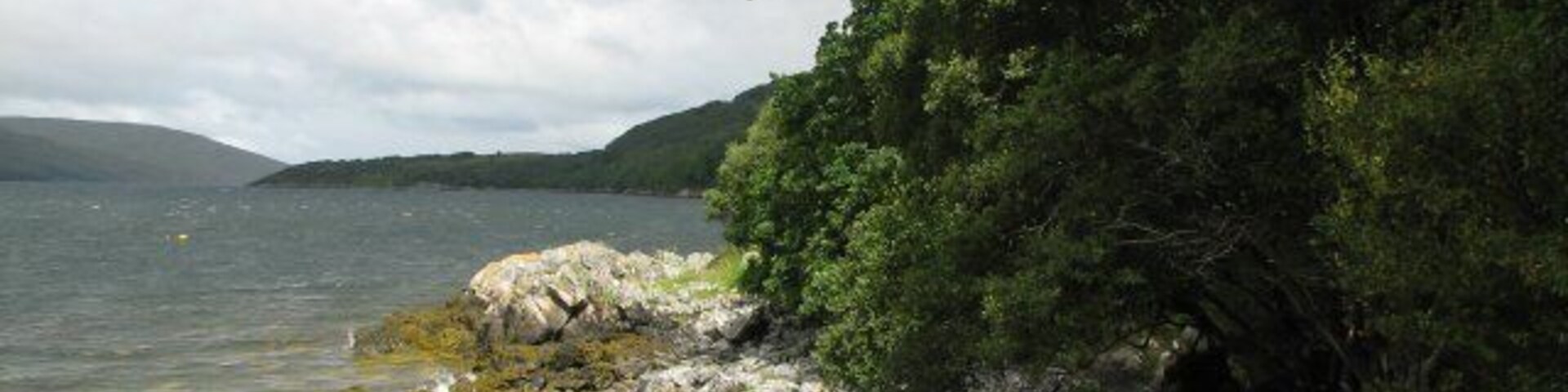 Loch Broom at Leckmelm The gardens at Leckmelm stretch down to the loch edge which may be accessed by a rhododendron covered path.