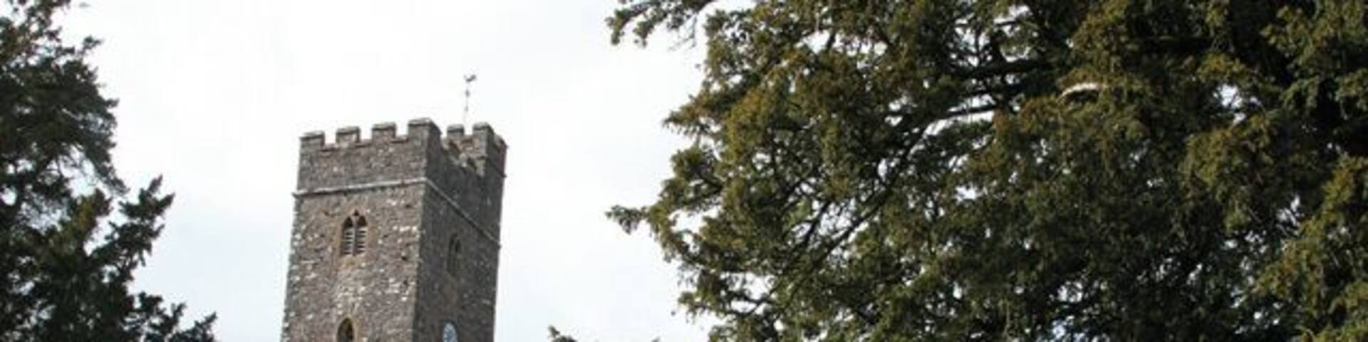 Huntsham: All Saints church Looking north-north-west. The church appears to have been thoroughly rebuilt in the 19th century. The dedication dates from 1897; the medieval patron had been forgotten by 1742