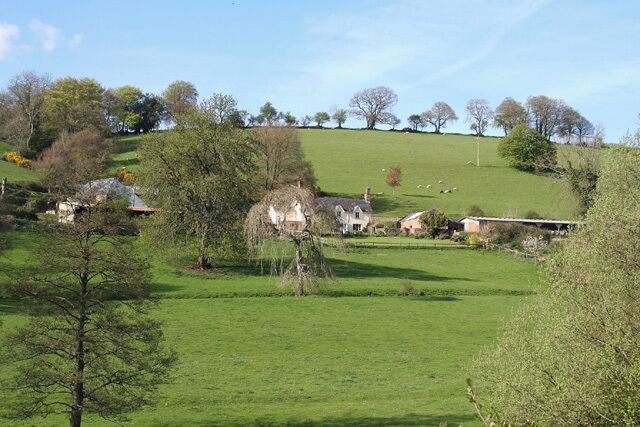 Chipstable: Washers Farm. Looking north-north-east. The farm faces south in an east-west valley; below it a stream runs westwards from Raddington to join the Batherm near Batherm Bridge