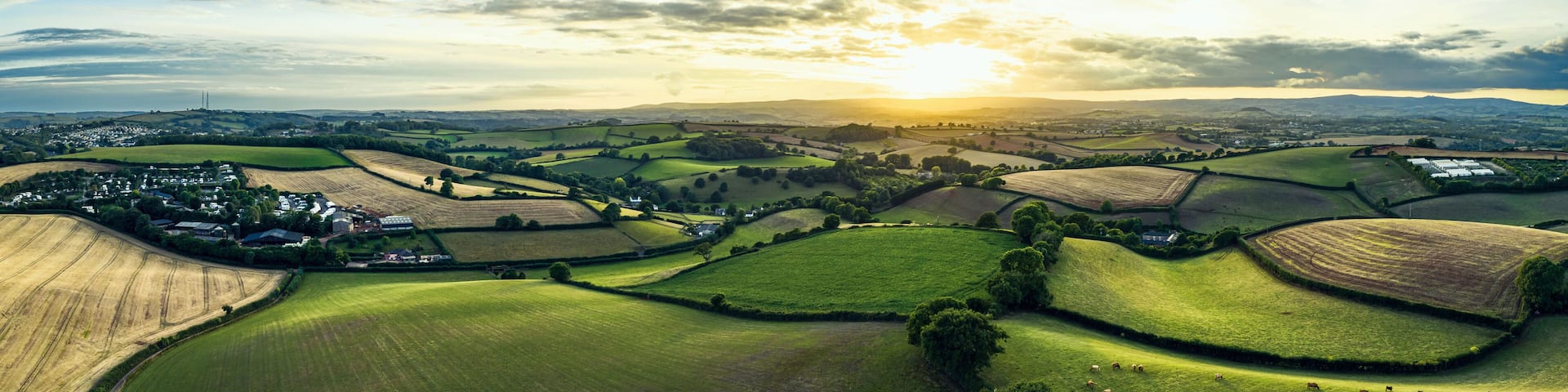 Sunset over Farmlands and Fields from a drone, Devon, England, Europe