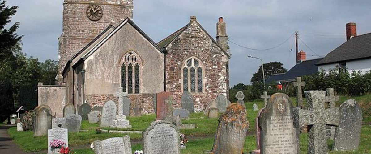 Rackenford: All Saints church. The building was closed to visitors in September 2006 while conservation and repair work was undertaken by a specialist masonry firm. The nearby 12th century Stag Inn predates the church. Looking west-north-west