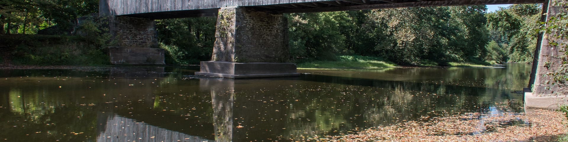 Originally built in 1873 and rebuilt in 1997 after a 1991 fire, the Schofield Ford Covered Bridge was constructed with native hemlock and oak.