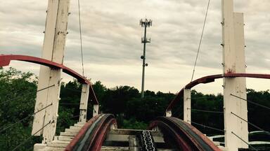 "The Point of No Return" at the top of the lift hill of one of the oldest wooden roller coasters in the world. A thrilling ride that speeds through a figure eight along the shore of West Lake Okoboji.