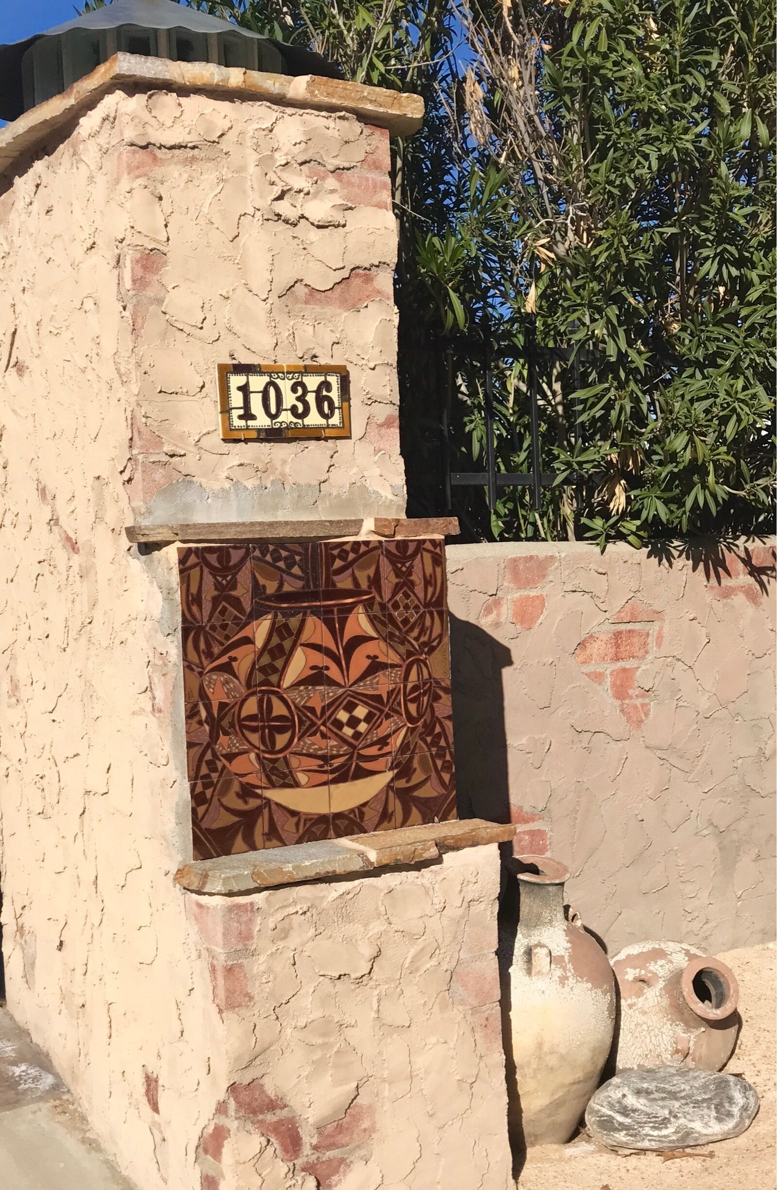 The entrance to this Mexican hacienda with its vintage pots and traditional tile work caught more of my attention than the actual home.