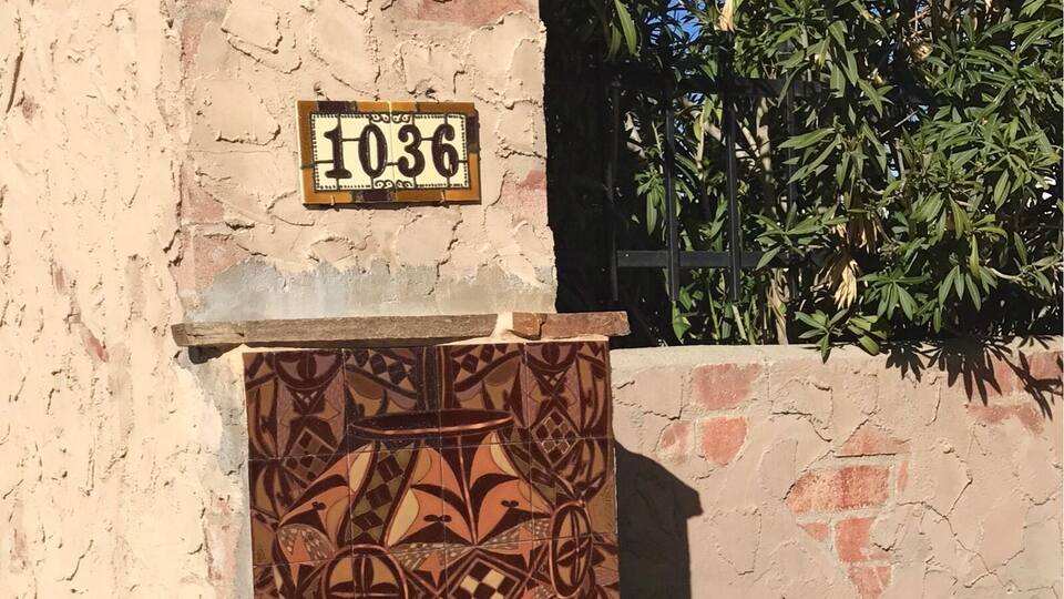The entrance to this Mexican hacienda with its vintage pots and traditional tile work caught more of my attention than the actual home.