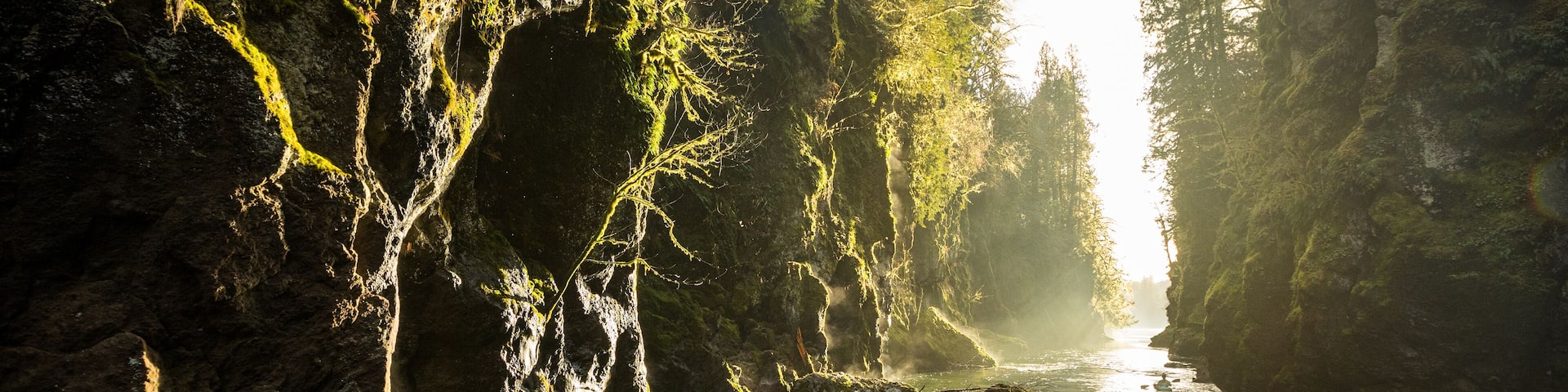 Kayakers paddle through a canyon on the Tilton River in Washington