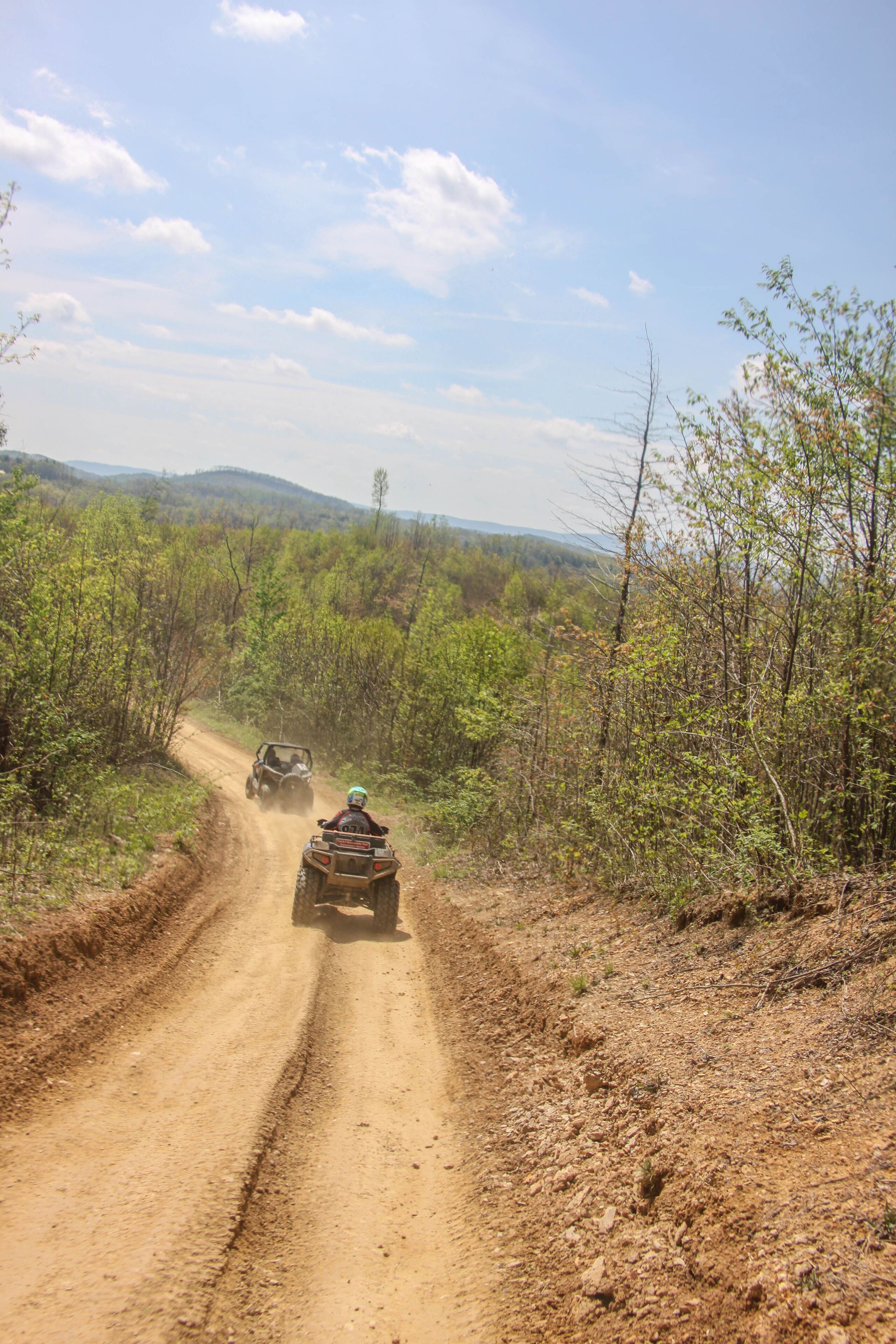 Cruisin down trail under cloudy blue sky in West Virginia