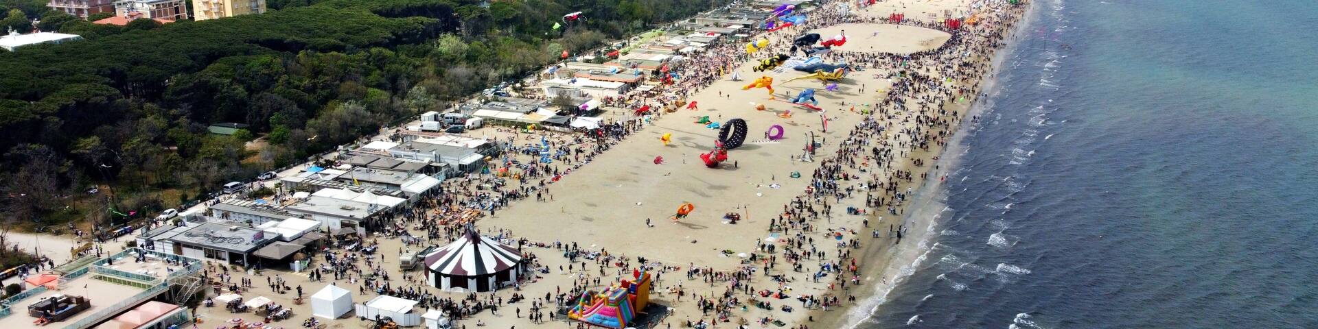 Aerial view of a gathering of kites on the beach at Pinarella di Cervia, Ravenna, Italy