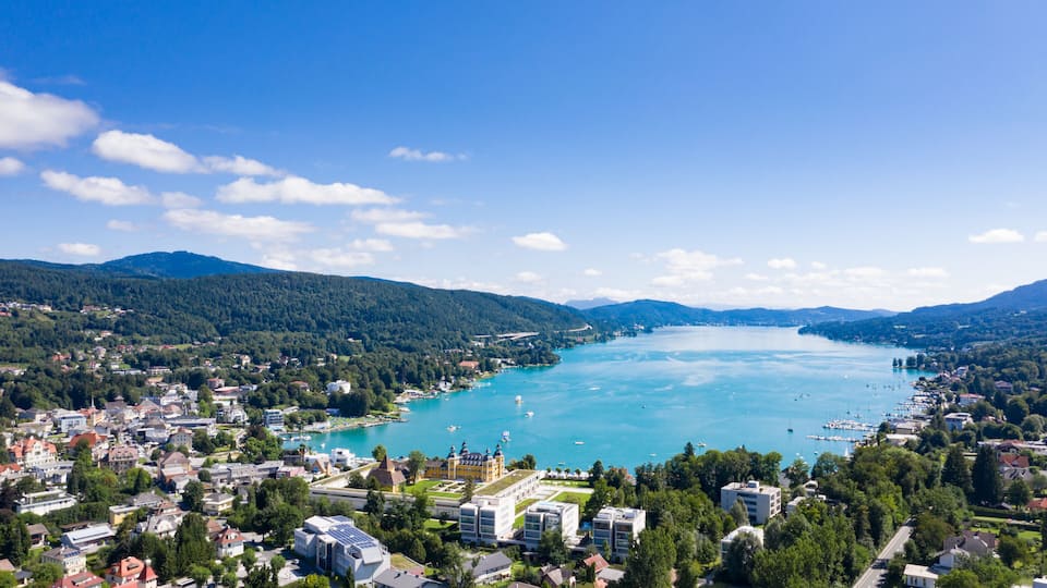A coastal town with a bay, boats, and buildings.