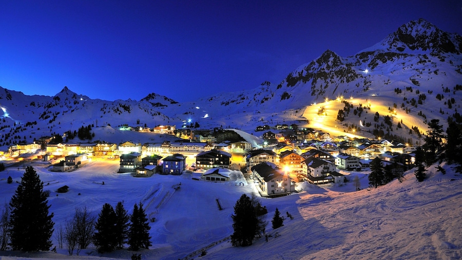Obertauern featuring a small town or village, night scenes and snow