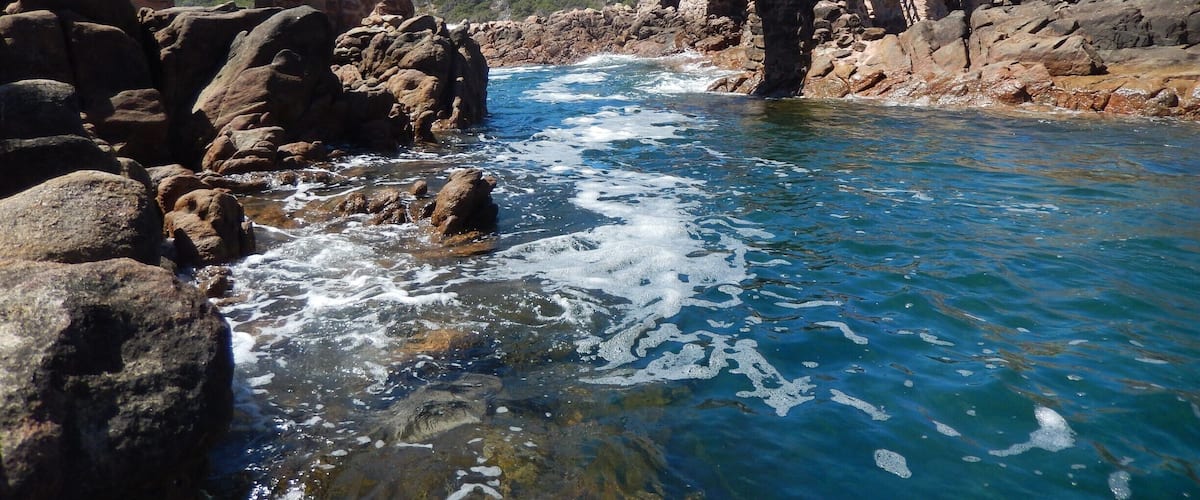The surf is forced through this narrow channel.Swimmers get pushed back + forth in the water under this walkway.