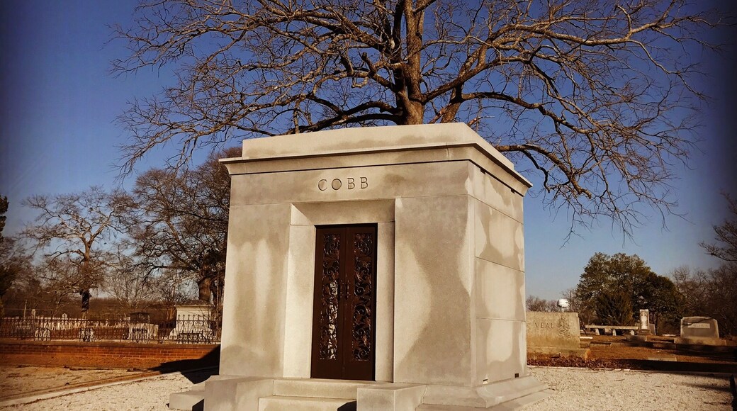 Burial site of Tyrus (Ty) Raymond Cobb in his home town of Royston, Georgia. Ty Cobb is widely regarded as one of, if not the best, baseball player of all time.
Nicknamed The Georgia Peach, Cobb was an American Major League Baseball outfielder. He was born in rural Narrows, Georgia. Cobb spent 22 seasons with the Detroit Tigers, the last six as the team's player-manager, and finished his career with the Philadelphia Athletics. In 1936 Cobb received the most votes of any player on the inaugural Baseball Hall of Fame ballot, receiving 222 out of a possible 226 votes (98.2%); no other player received a higher percentage of votes until 1992. In 1999, editors at the Sporting News ranked Ty Cobb 3rd on their list of "Baseball's 100 Greatest Players".
Cobb is widely credited with setting 90 MLB records during his career. He still holds several records as of the end of the 2016 season, including the highest career batting average .367 and most career batting titles with 12. He retained many other records for almost a half century or more, including most career hits until 1985 with 4,191, most career runs with 2,246 until 2001, most career games played (3,035) and at bats (11,434) until 1974, and the modern record for most career stolen bases (892) until 1977. He still holds the career record for stealing home (54 times) and for stealing second base, third base, and home in succession (5 times), and as the youngest player ever to compile 4,000 hits and score 2,000 runs. Cobb ranks fifth all-time in number of games played and committed 271 errors, the most by any American League (AL) outfielder.