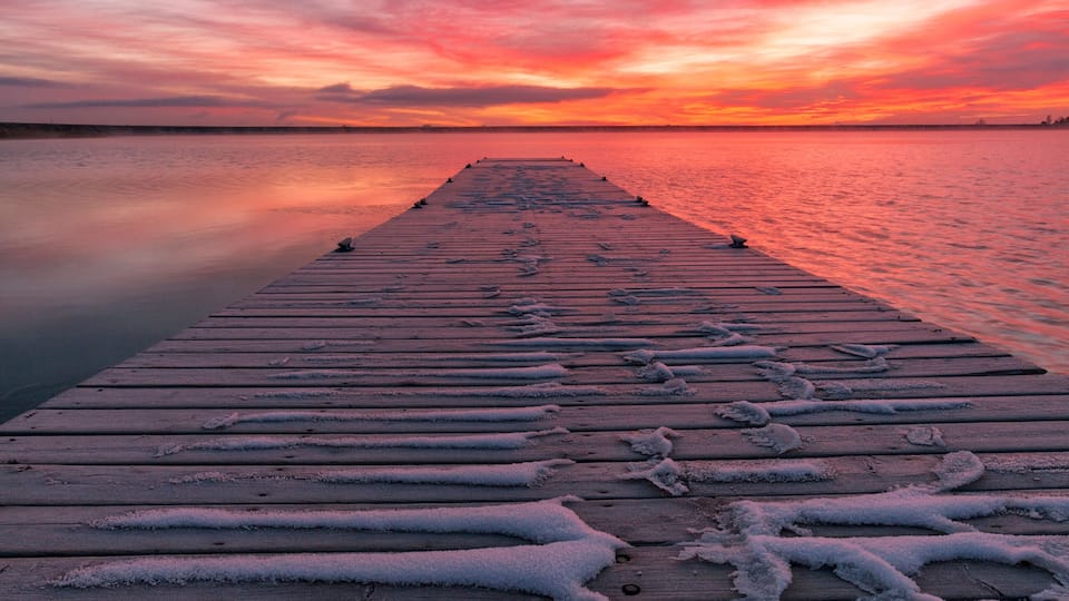 Colorful Colorado Sunrise with beautiful clouds and a fishing dock