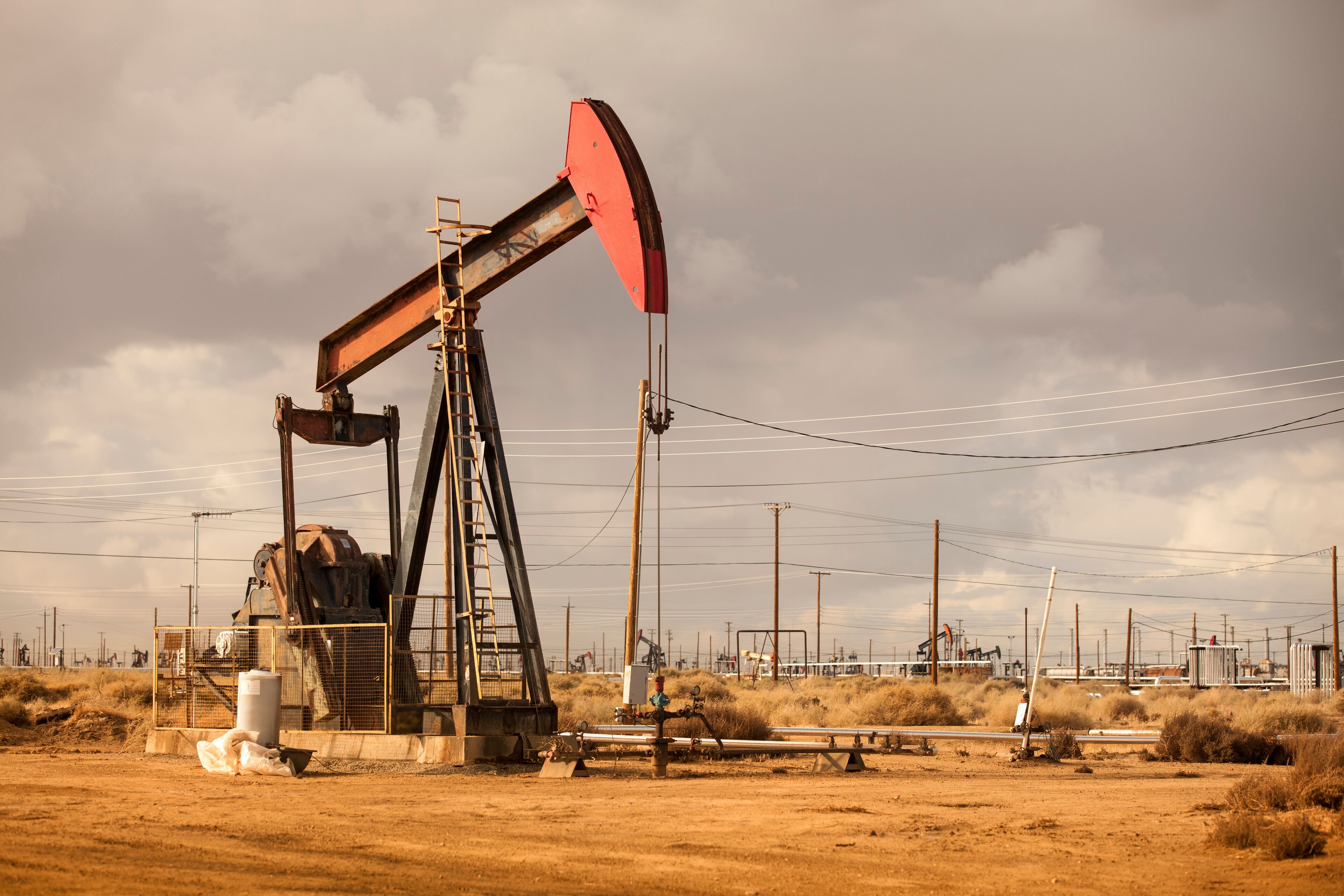 Oil Well Pumpjack Operating in Industrial Field