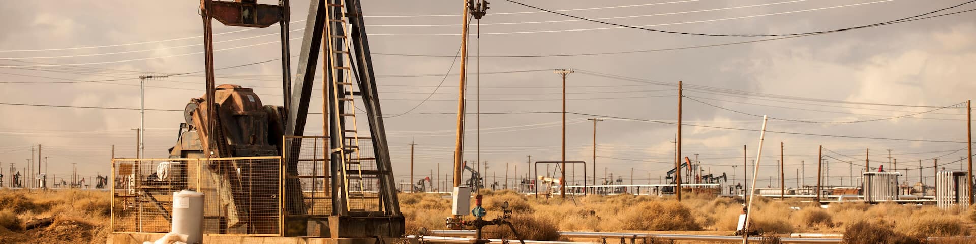 Oil Well Pumpjack Operating in Industrial Field
