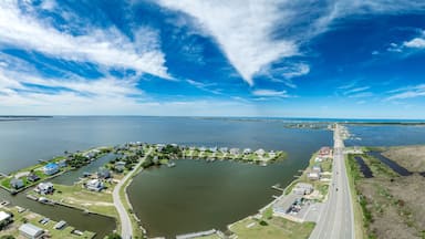 Aerial view of Pond Island Outer Banks NC OBX, coastal highway connecting the outer islands to the mainland with marina, luxury vacation homes