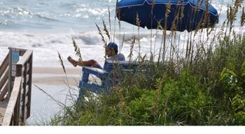 A day at the Beach - a watchful Lifeguard keeping an eye on the people in the surf!