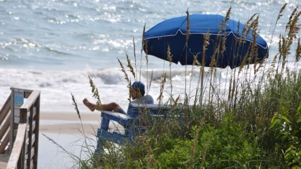 A day at the Beach - a watchful Lifeguard keeping an eye on the people in the surf!