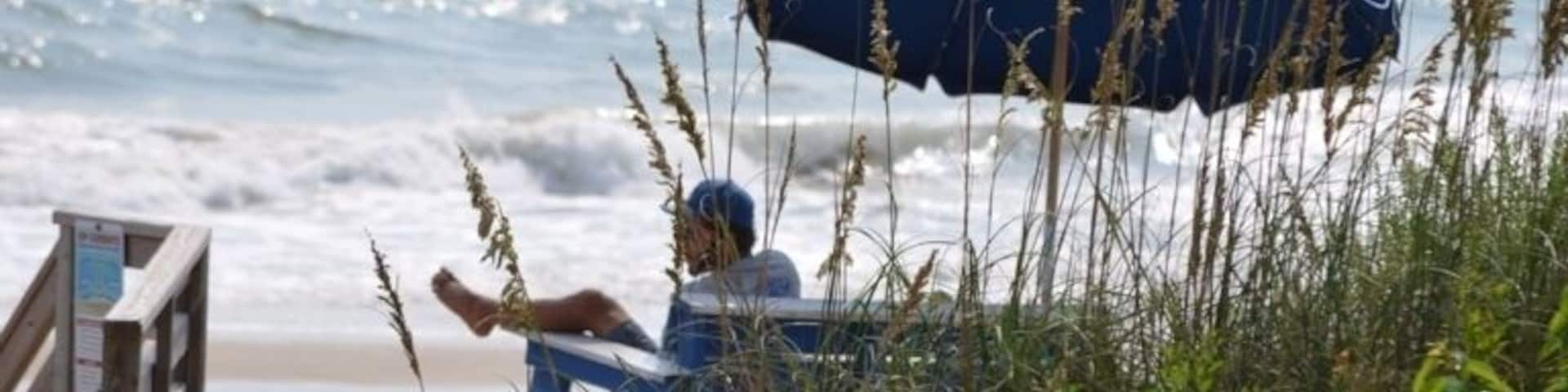A day at the Beach - a watchful Lifeguard keeping an eye on the people in the surf!