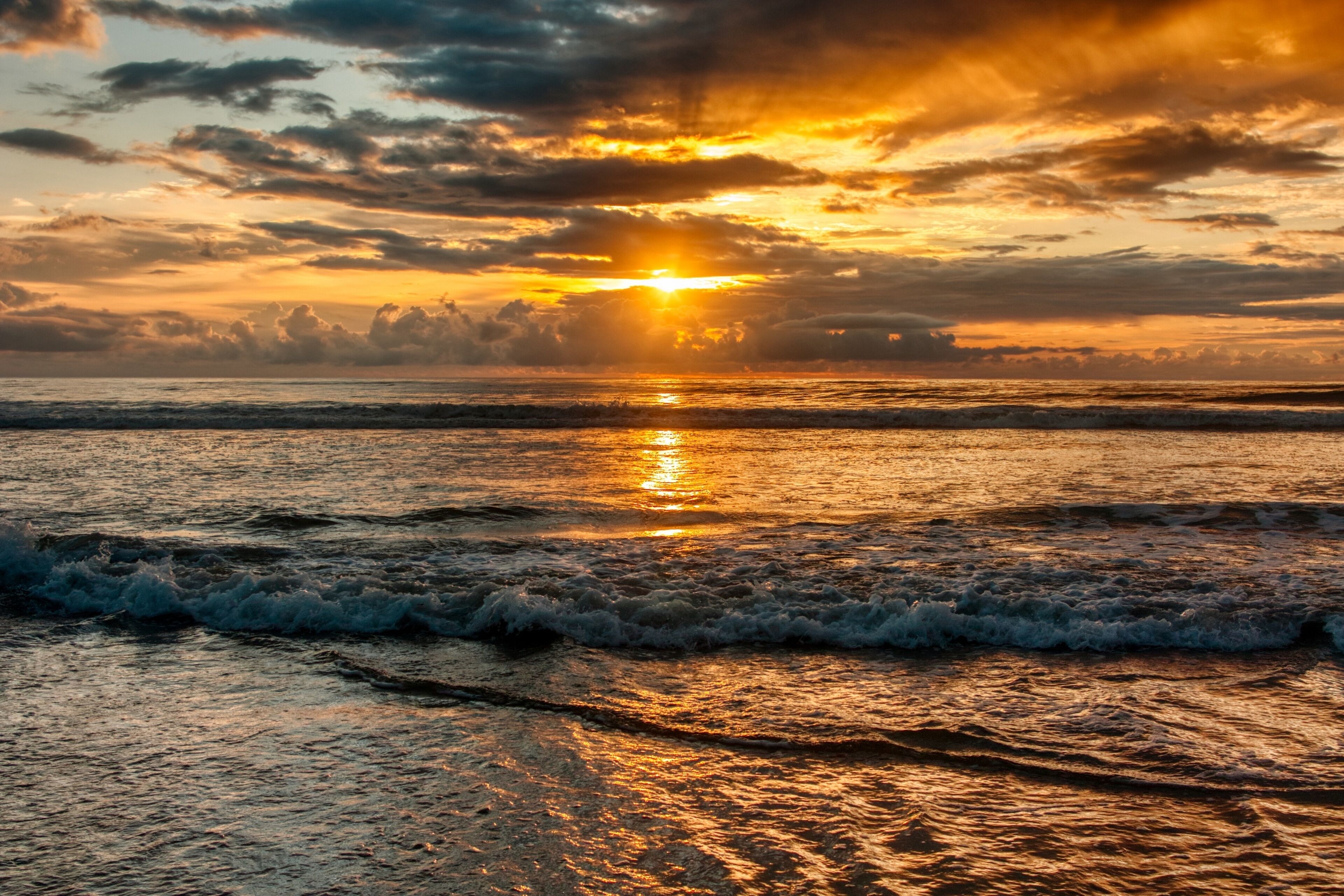 I woke up at 5 to try to get a good sunrise. When I got to the beach, it was starting to rain. Somehow, I got lucky, the rain stopped, and I got this.

#Adventure