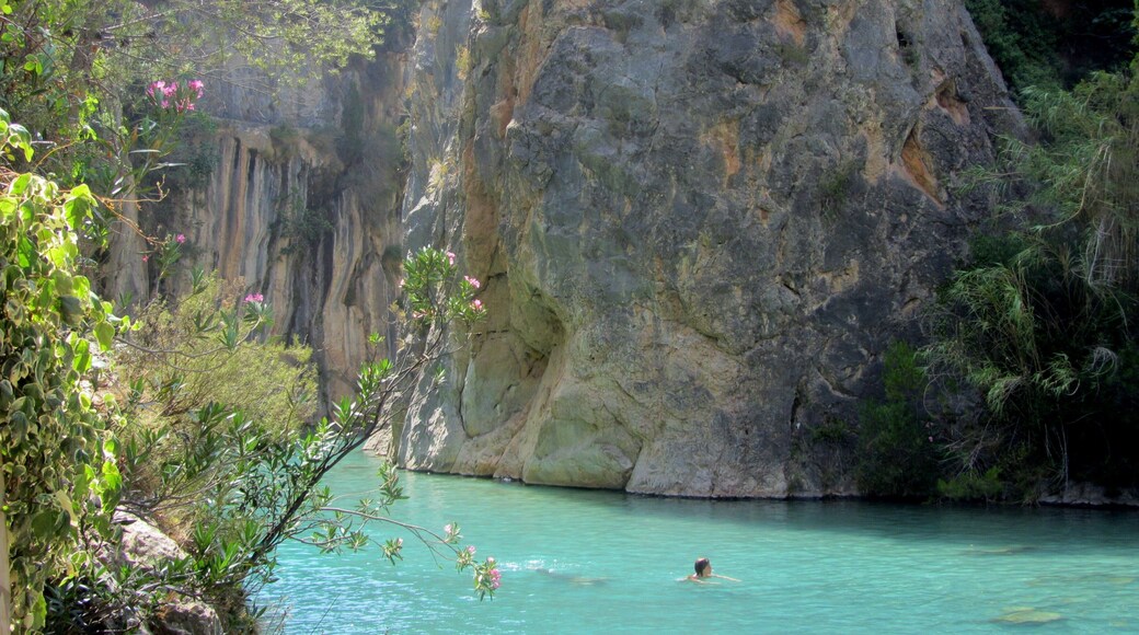 Clear blue waters and a stunning canyon surround this little river near the town of Montanejos, Spain. It is a short drive from the big town of Valencia, and was my favorite place to escape the city and the heat when I lived in Valencia. Hardly any crowds, you can swim down the calm springs to find underwater caves, mini waterfalls, and of course nearby restaurants in the town for sangria and tapas. #LiveLikeALocal