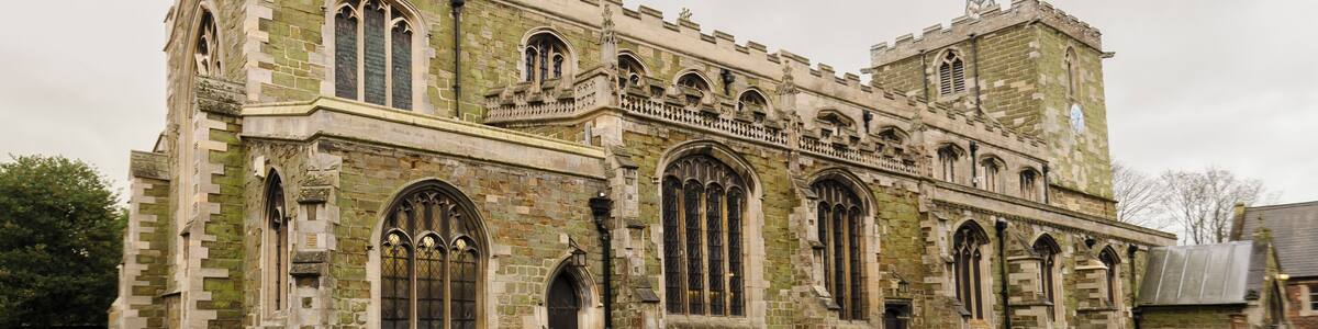 Grade II listed The church dates from the early 13th century onwards, and was restored in 1859-61 by Ewan Christian. It is built in green sandstone and has a west tower with spirelet, nave with north and south aisles, chancel with north and south aisles, north porch and vestry. The tower dates from circa 1200, and was remodelled in 1861. The upper part is from the decorated period. The nave arcades are of five bays and date from the early 13th century. These were restored in 1861. The chancel has 15th century arcades, two to the north and three south, again heavily restored. The chancel arch dates from the Victorian restoration. The reredos also dates from this time, and is by C. E. Giles. There is a Memorial brass to Sir Lionel Dymoke, died 1519, he was knighted at Siege of Tournai, and was Sheriff of Lincolnshire 1516. On the wall of the south aisle are mounted 13 scythes, which were thought to have been used in the Lincolnshire rising of 1536, although this is unlikely , despite Horncastle being one of the centres of the rebellion. There are several stained-glass windows, with some by Heaton Butler and Bayne, and one by Preedy. The church pipe organ was recently replaced with a new digital version. The freed up space has been converted into a Coffee area.