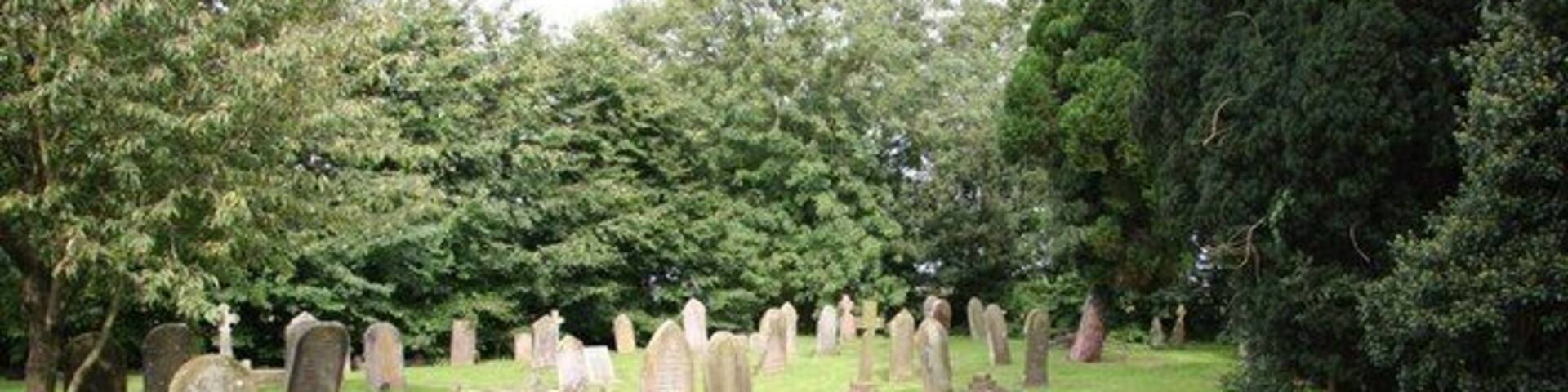 All Saints' churchyard Well tended churchyard at West Ashby