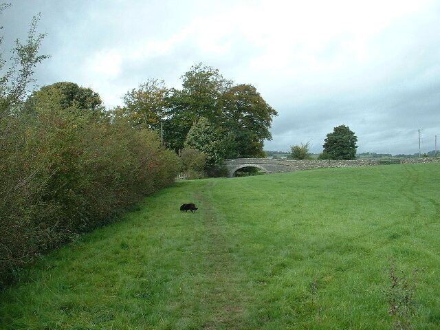 Crowpark Bridge. On the disused Lancaster Canal near Kendal. It's difficult to imagine that this 'normal' part of a farm field was once a major waterway. There is no water in the canal between Hincaster tunnel and Kendal with many sections, such as this one, completely filled in.
