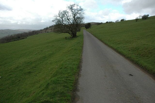Unfenced road to Helsington church Open road above the Lyth Valley to Helsington church.
