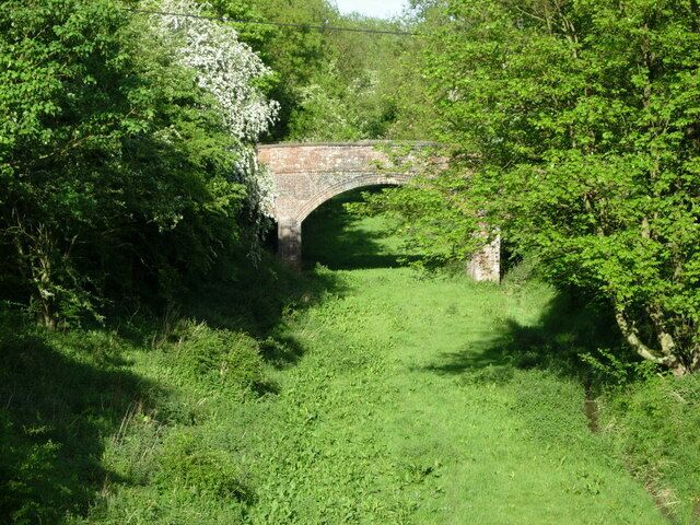 Dismantled Railway, Husbands Bosworth. Looking east along the Rugby - Peterborough railway, which closed in 1966, from the A5199 bridge just north of Husbands Bosworth village. The Grand Union Canal (Leicester Arm) crosses the old railway in a tunnel at this point.