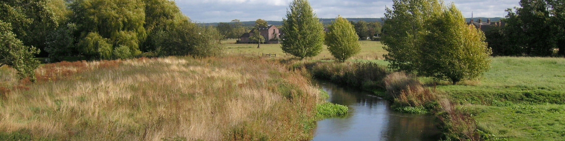 The River Penk, with Roller Mill in distance, from Bull Bridge, Penkridge, Staffordshire.