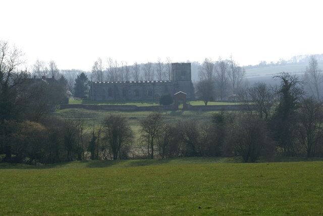 St Giles through the haze St Giles Church, Chesterton, taken from the hillside to the north. This would have been pretty much the view of the church from the former Chesterton House, demolished in 1802. The heat haze adds to the atmosphere of this ancient building.