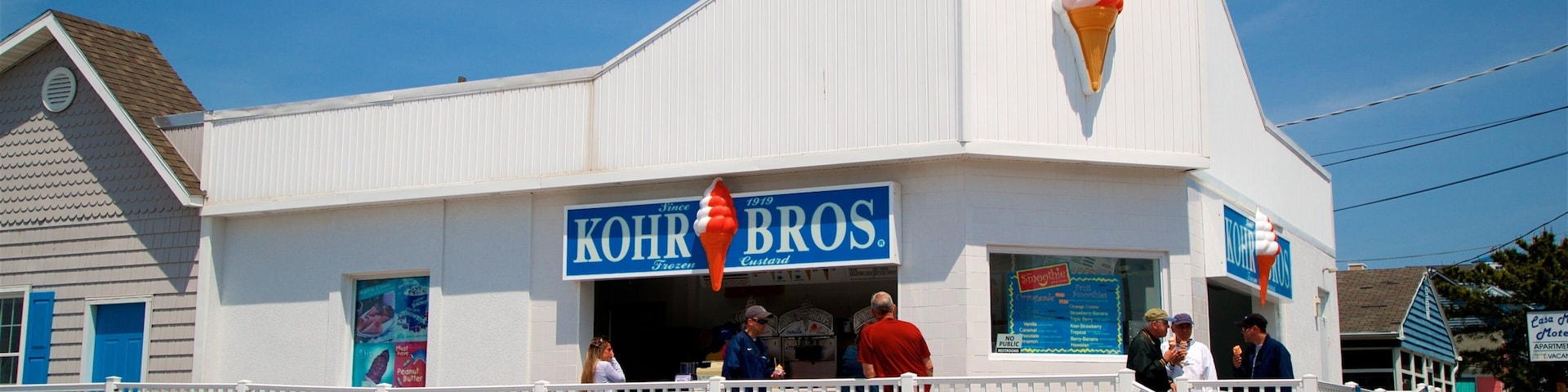 Fenwick Island which includes signage as well as a small group of people