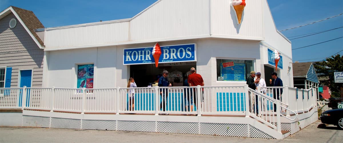 Fenwick Island which includes signage as well as a small group of people